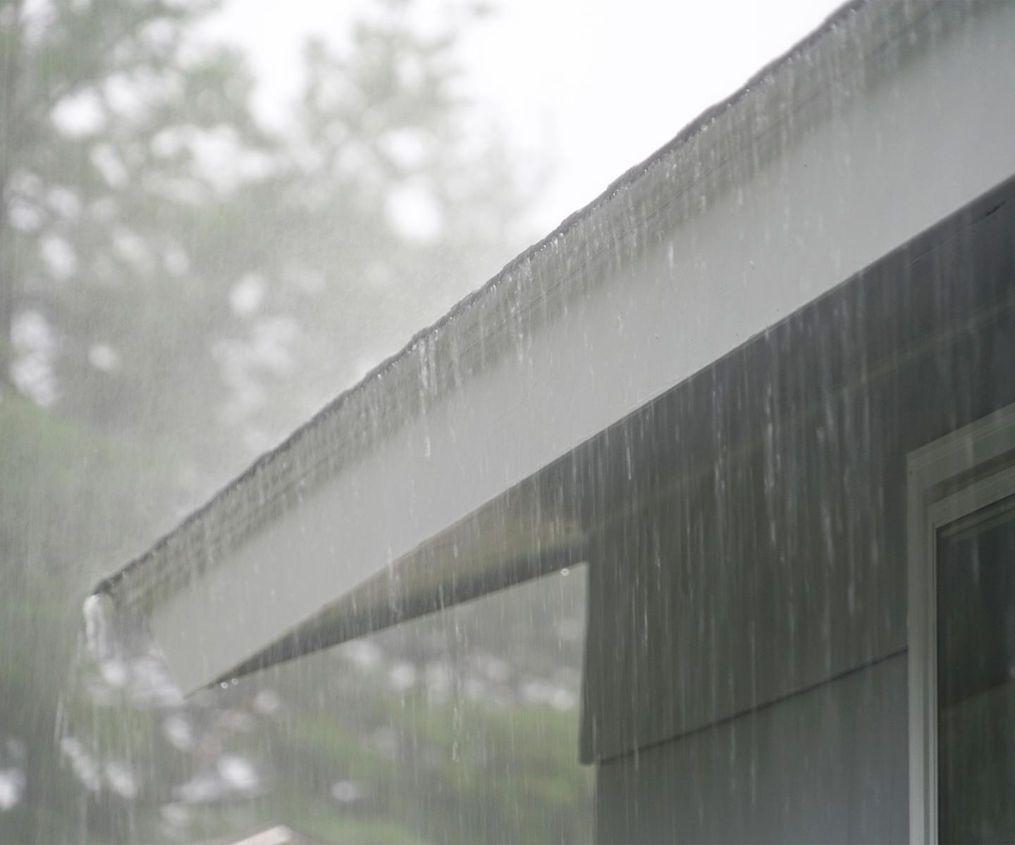 Rain on roof and draining into gutters