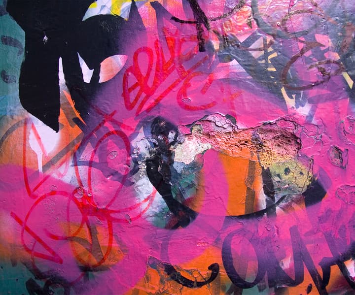 Photo of wall full of graffiti and vandalism